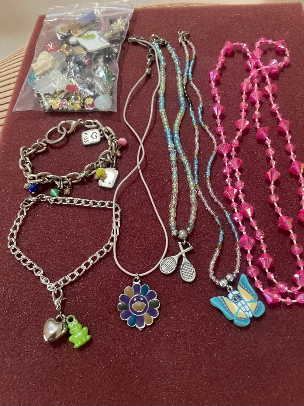 Girl’s 4 necklace, 2 charm bracelets, Bag of charms. Great for crafting